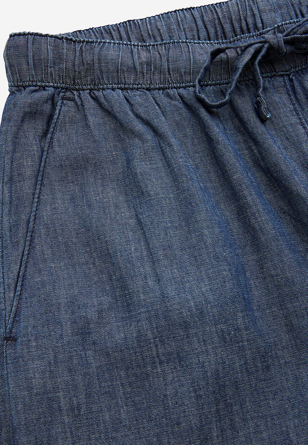 Byxa i denim med vida ben