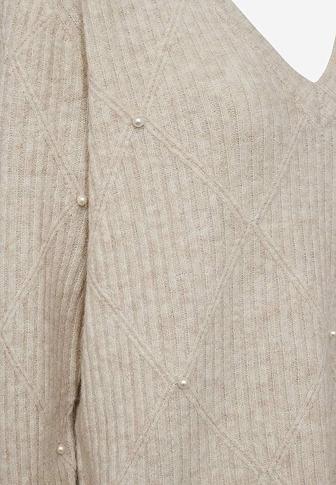 Stickad tröja med pärldetaljer