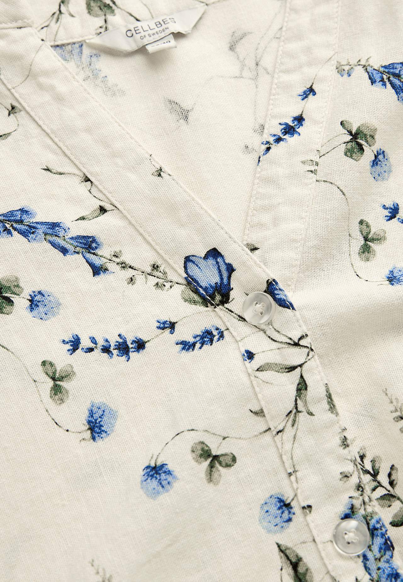 Blommig linnetunika med knappar