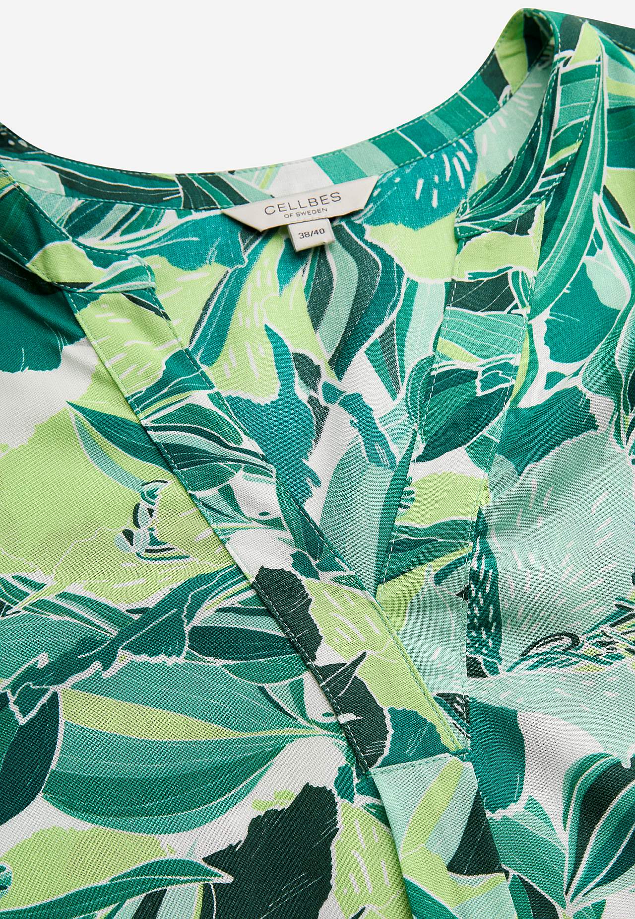 Ärmlös, blommönstrad tunika med fickor