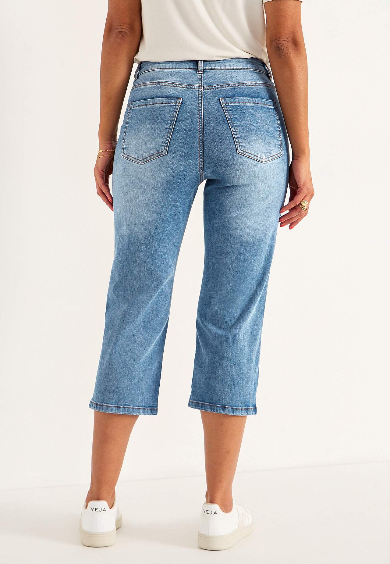 Caprijeans med knappgylf