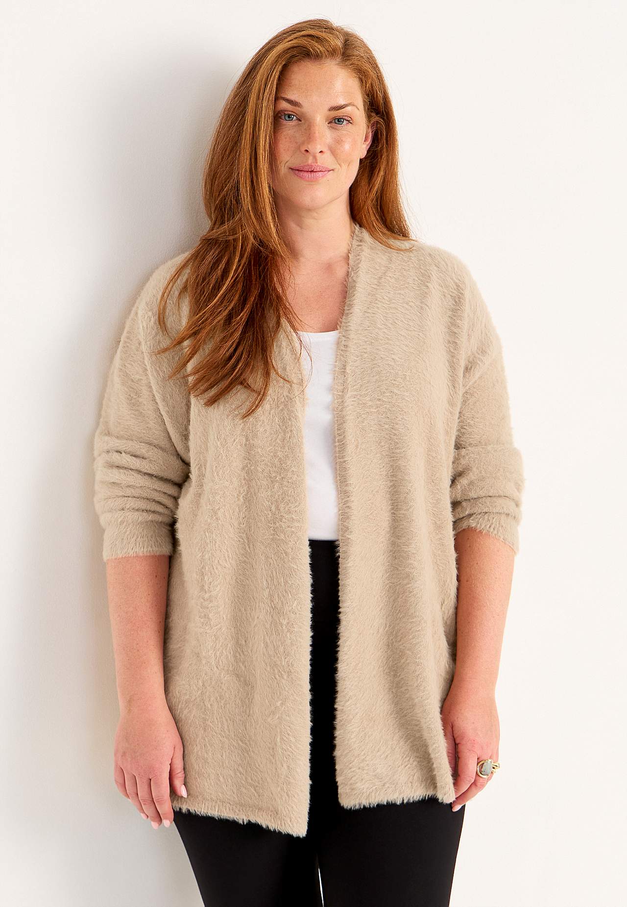Stickad, öppen cardigan