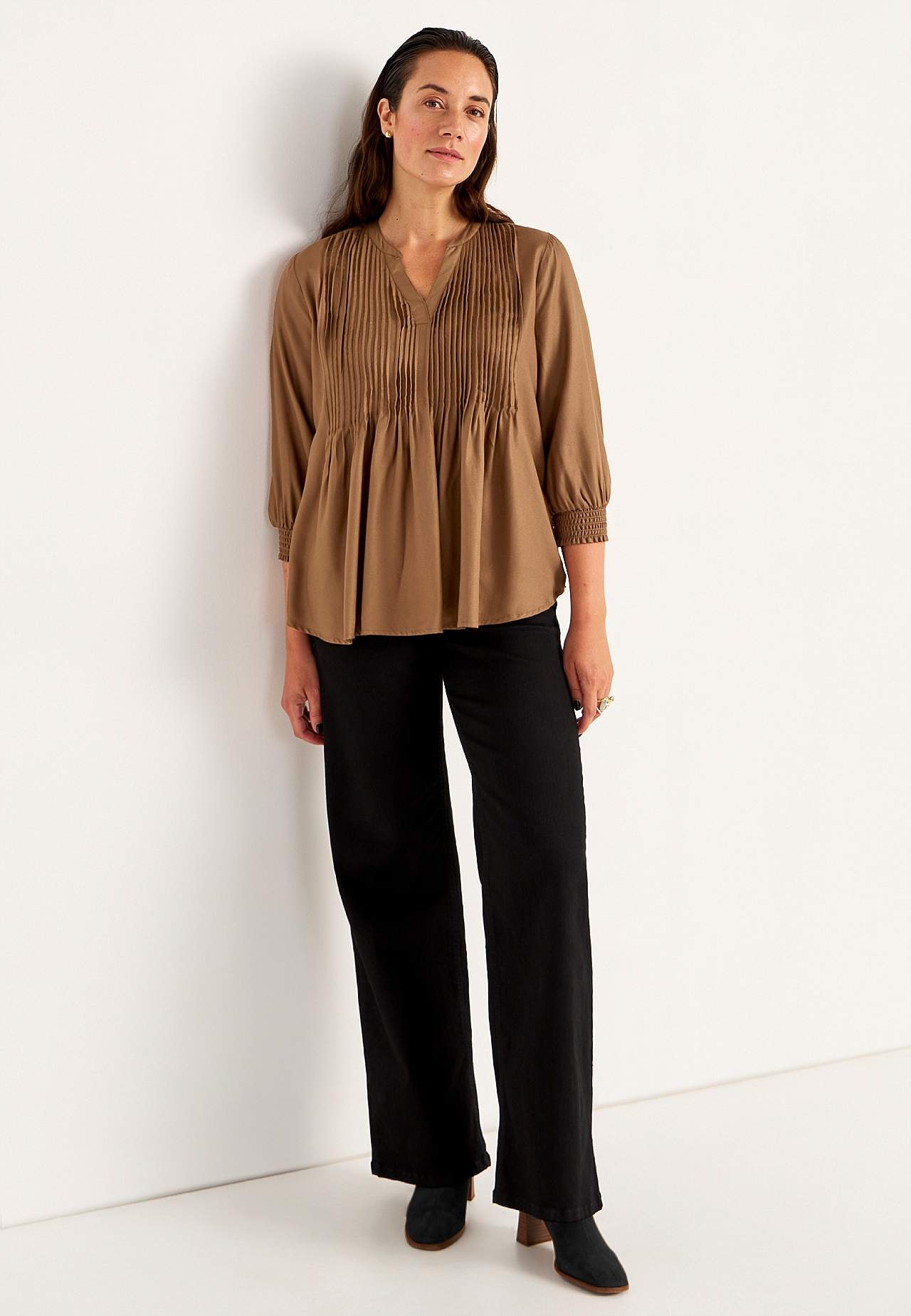 Blus med sydda veck