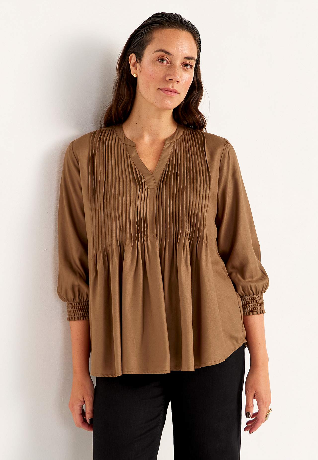 Blus med sydda veck