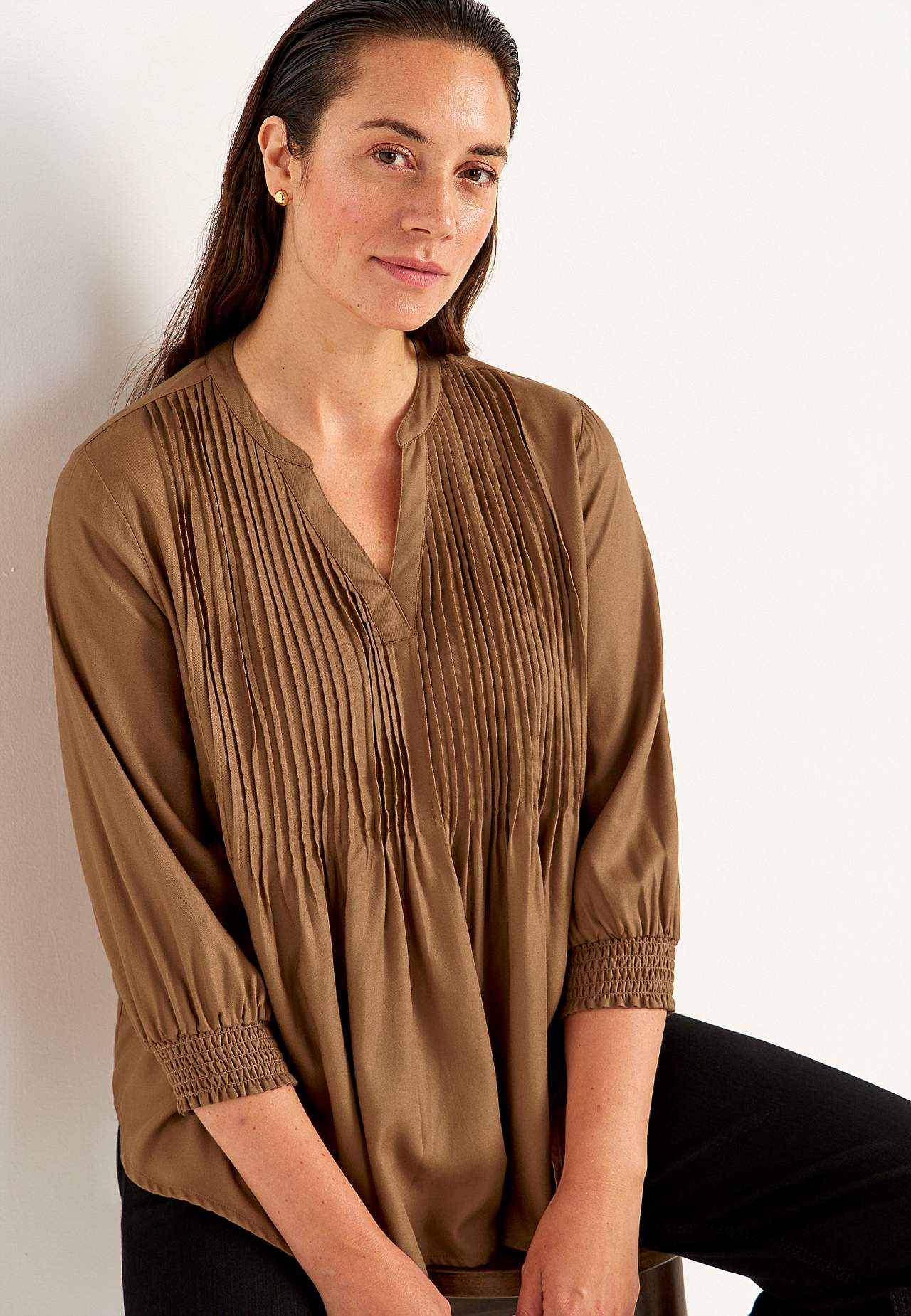 Blus med sydda veck