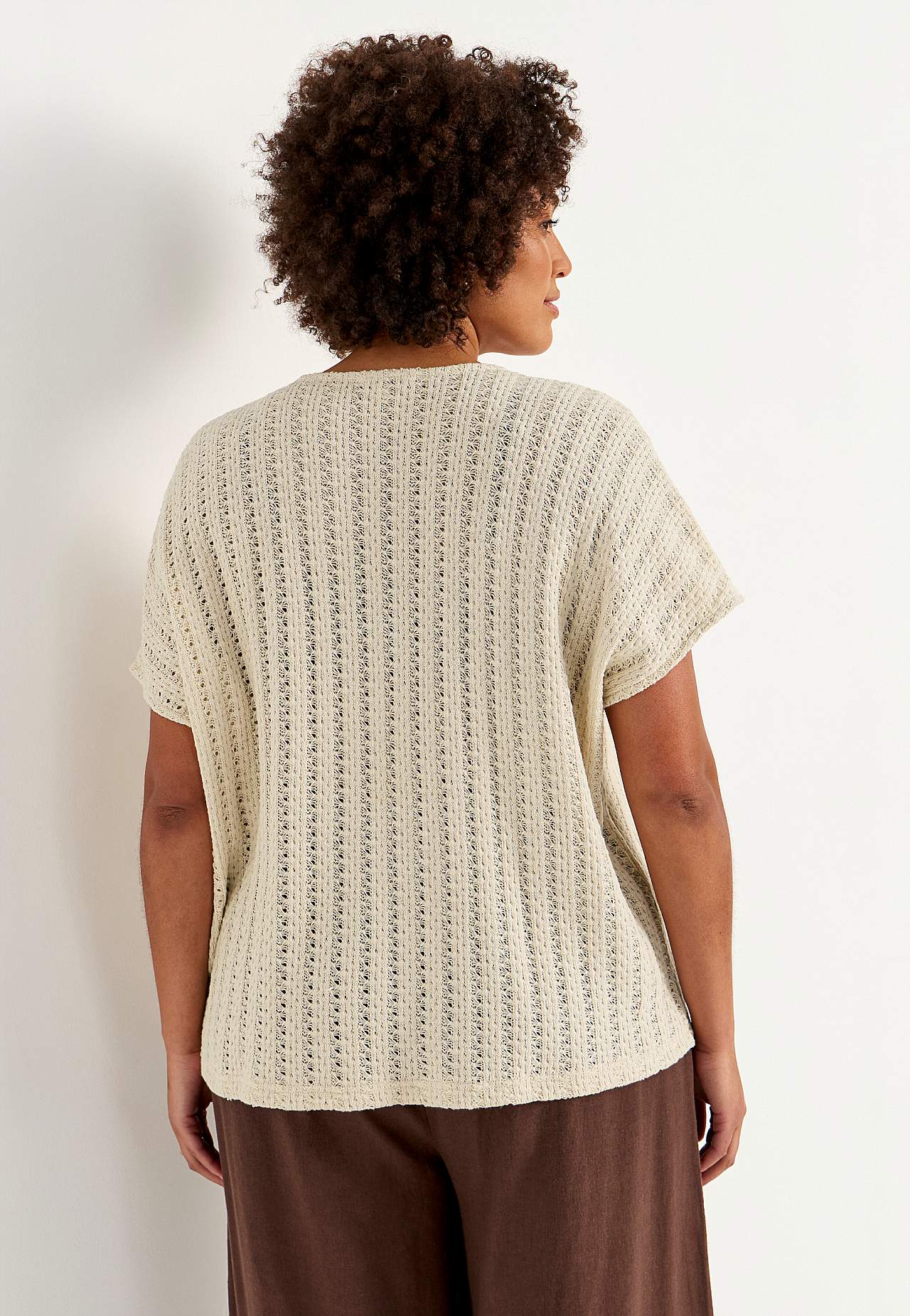 Trikåtopp med hålmönster