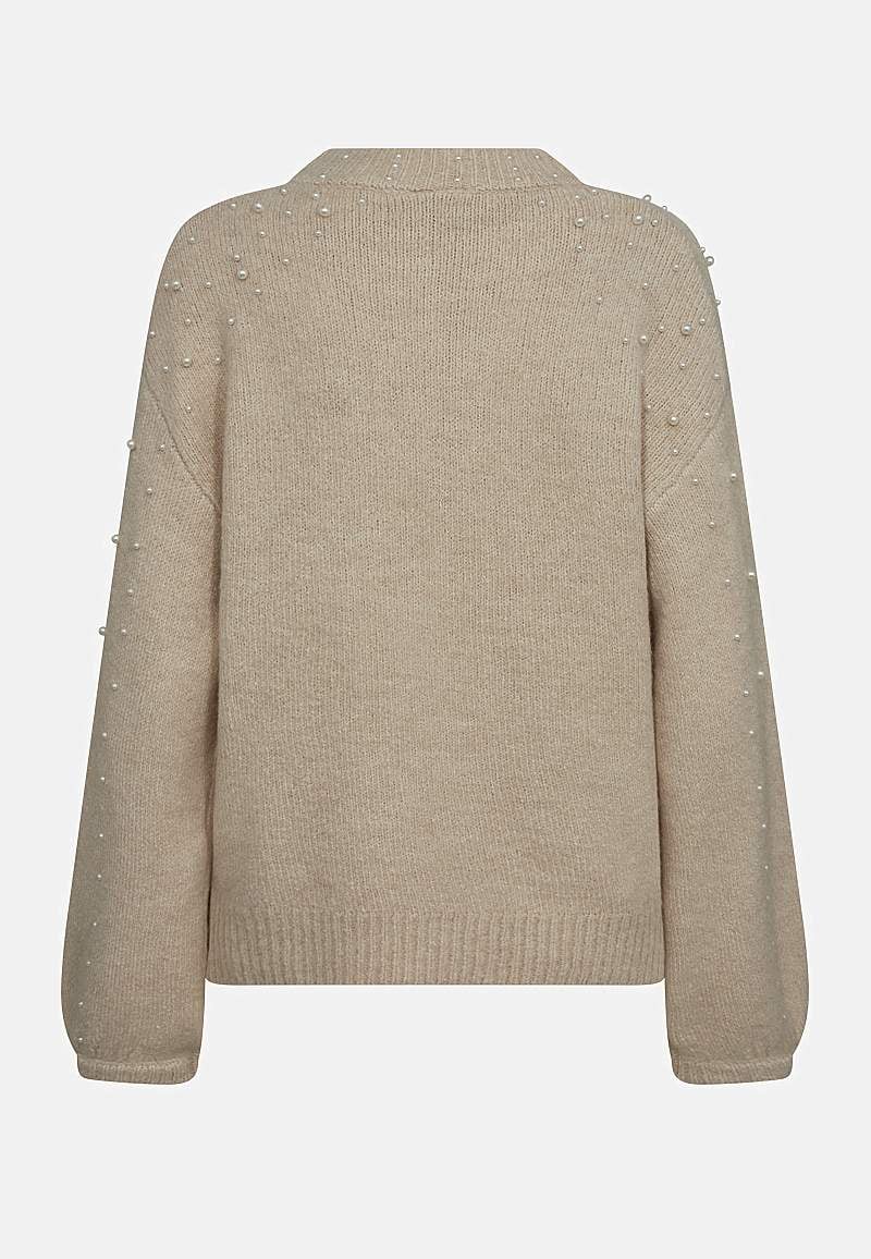 Stickad tröja med pärlor