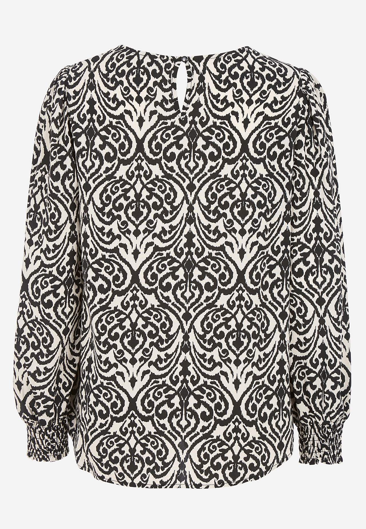 Blus med smock i ärmsluten