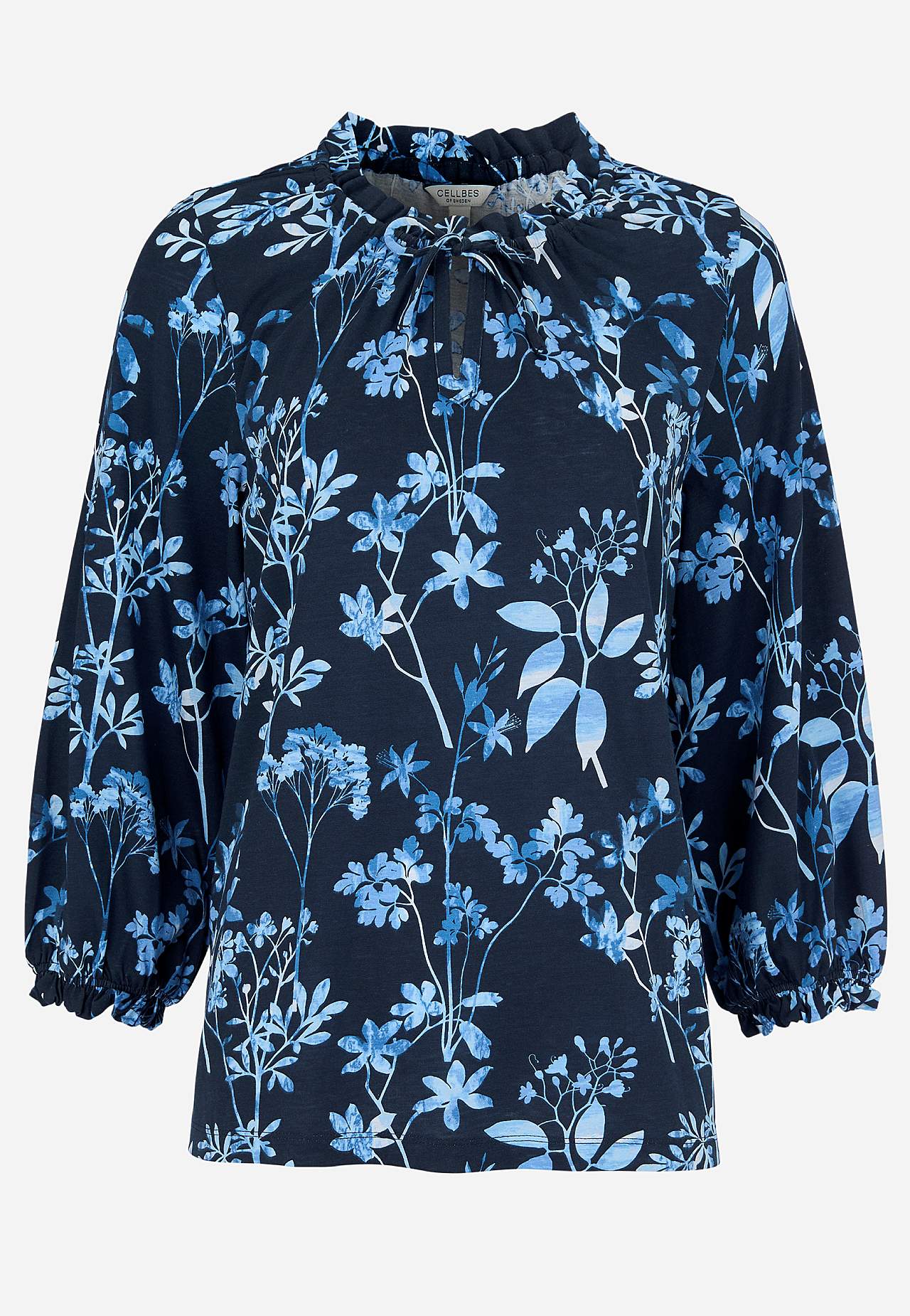 Mönstrad trikåtopp med volangkant