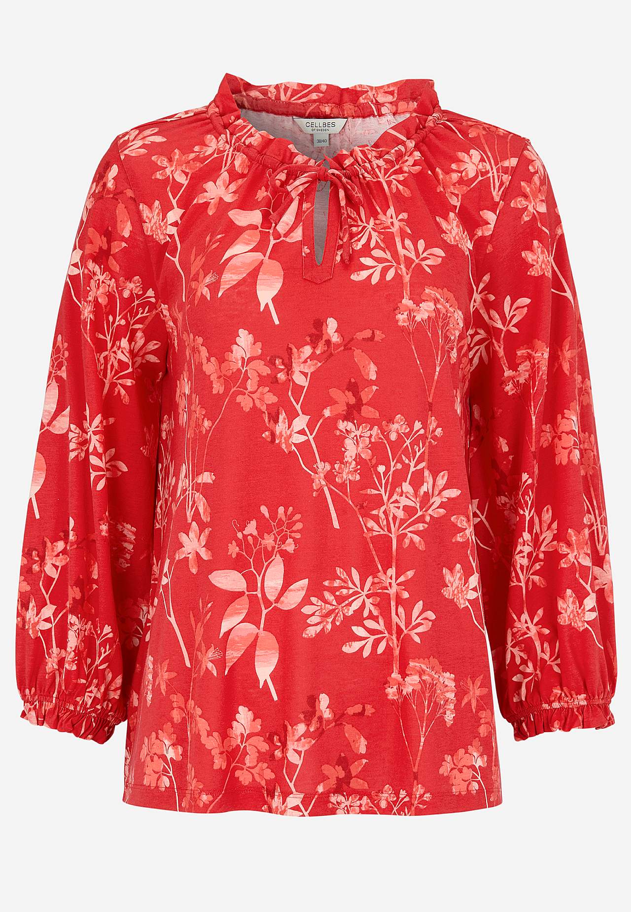 Mönstrad trikåtopp med volangkant