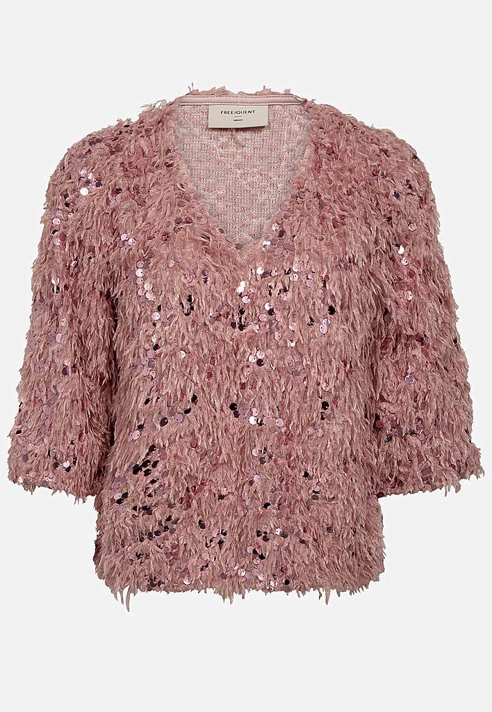 Festtopp med fjäderliknande material och paljetter