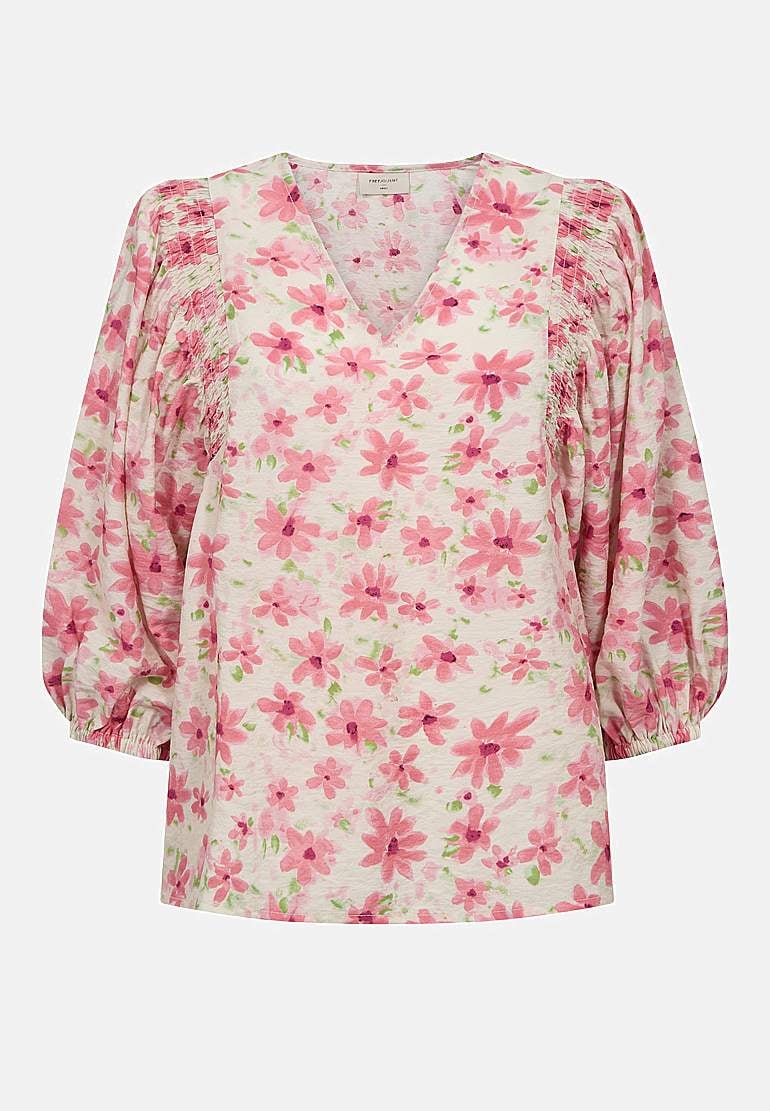 Blommig, vävd blus med smockdetalj